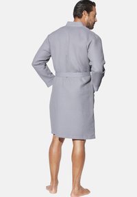 Gray, textured bathrobe with a waist belt, long sleeves, and a collar. Waffle pattern and knee-length design. Back view, no visible logo.