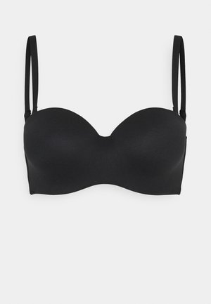 Soutien-gorge noir sans bretelles avec des bonnets lisses et rembourrés, et des bretelles fines ajustables. Design simple sans coutures visibles ni embellissements.