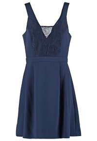 Robe bleu marine sans manches avec corsage en dentelle à col en V, taille cintrée et jupe évasée.