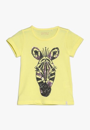 T-shirt jaune à manches courtes pour enfants avec un motif visage de zèbre en sequins noirs et violets sur le devant.