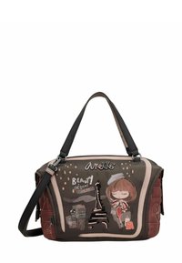 Sac à main synthétique marron avec des anses noires, présentant un motif cartoon, la Tour Eiffel, et le texte "La Beauté Commence Ici", avec des accents matelassés.