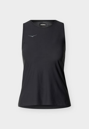 Schwarzes ärmelloses Sport-Top mit rundem Ausschnitt und kleinem reflektierendem Logo auf der linken Brust, vor neutralem Hintergrund dargestellt.