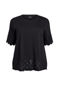 Sort kortærmet top lavet af bomuld, med broderede detaljer på ærmerne og et dekorativt udskåret blomsterdesign i kanten.