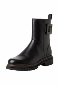 Bottine en cuir noir avec bout arrondi, semelle en caoutchouc épaisse, détail de boucle sur le côté et accents cousus à la base.