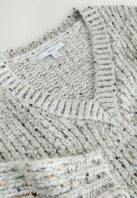 Light gray knitted sweater with a v-neck, featuring subtle sequins and ribbed accents along the neckline and hem. Brand label visible.