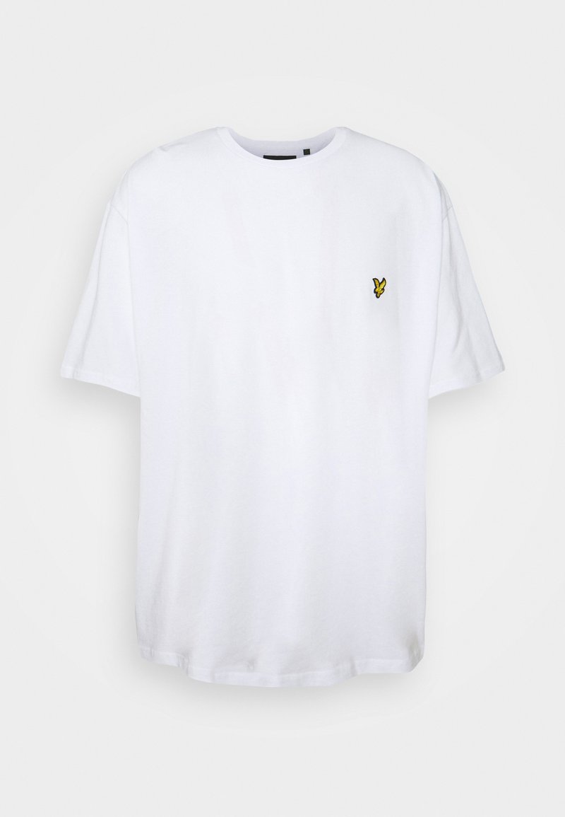 Hvid bomulds t-shirt med rund halsudskæring og korte ærmer, der har et lille gult broderet logo på venstre bryst.