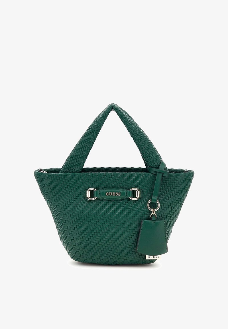 Green woven tote bag with two short handles, silver hardware, and a detachable tag. Textured surface with a structured shape.