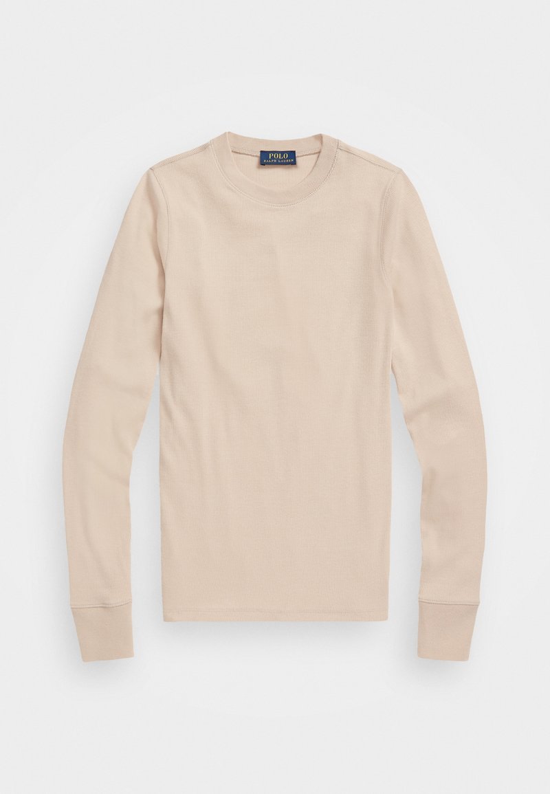 Chemise beige en maille côtelée à manches longues avec col rond et étiquette Polo Ralph Lauren au col, posée à plat sur un fond blanc.