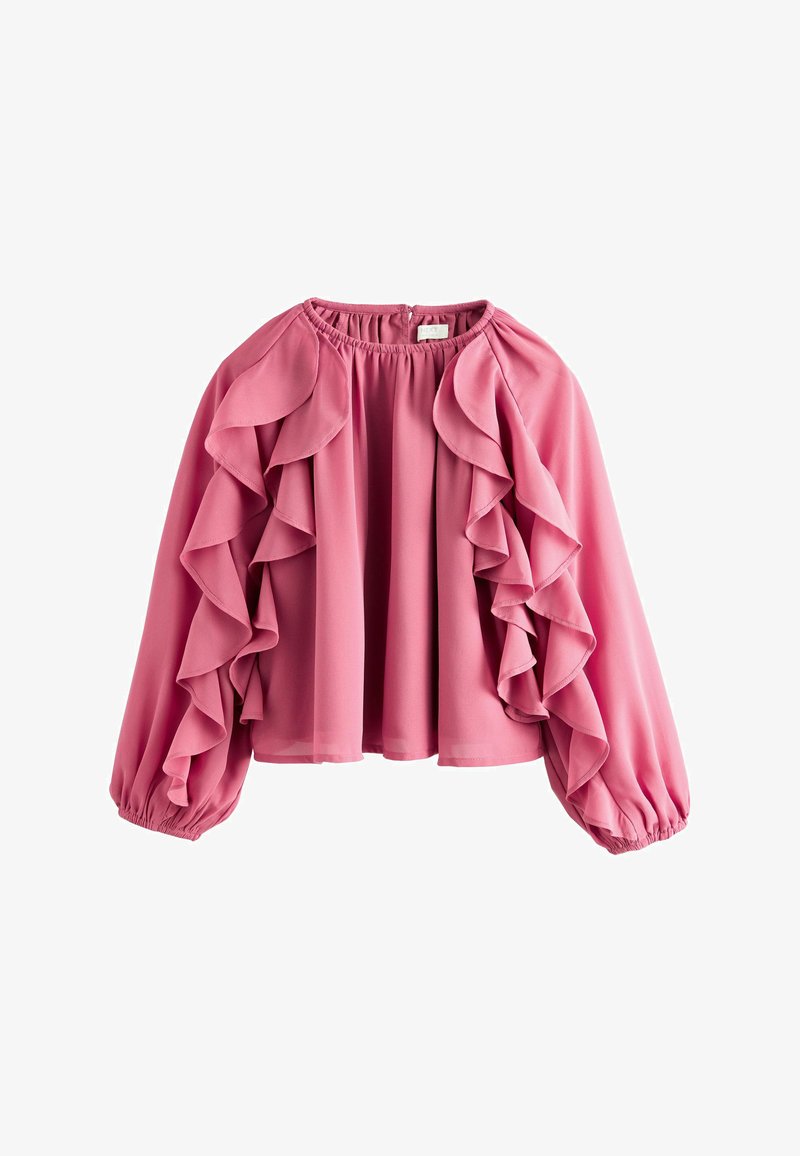 Blouse rose à volants avec un col rond, des manches ballon longues et des détails en volants superposés. Fabriquée en tissu léger avec une texture douce.