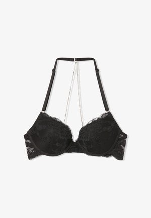 Reggiseno in pizzo nero con coppe imbottite, motivo floreale, spalline regolabili e un dettaglio decorativo a catena che collega le spalline sul retro.