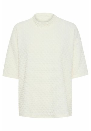 Struktūruotas kreminės spalvos viršus su imitaciniu kaklu, trumpomis rankovėmis ir laisvu siluetu. Pasižymi iškilu deimantiniu raštu visame paviršiuje.