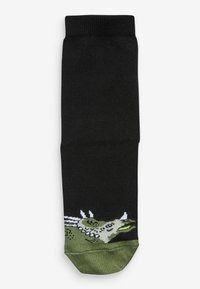 Schwarze Baumwollsocke mit einem grün-weißen grafischen Design eines Wesens auf der Zehenpartie, mit geripptem Textur am oberen Ende.