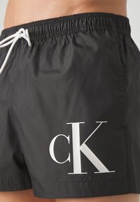 Calvin Klein Swimwear DRAWSTRING - Swimming shorts - black