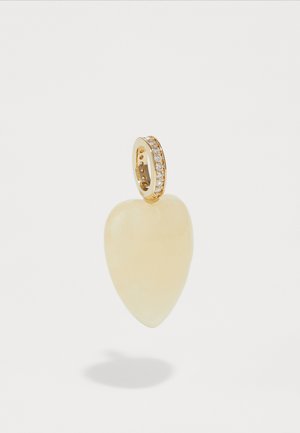 Heart-shaped pendant made of pale yellow gemstone, featuring a gold bail adorned with clear gemstones along the band.