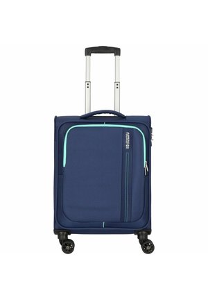 Valigia blu navy con una tasca frontale con zip, dettagli in turchese, manico metallico retrattile e quattro ruote nere per la mobilità.