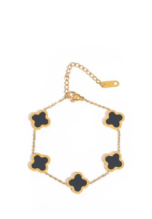 Gold chain bracelet with five black clover-shaped charms and a lobster clasp closure with adjustable links.