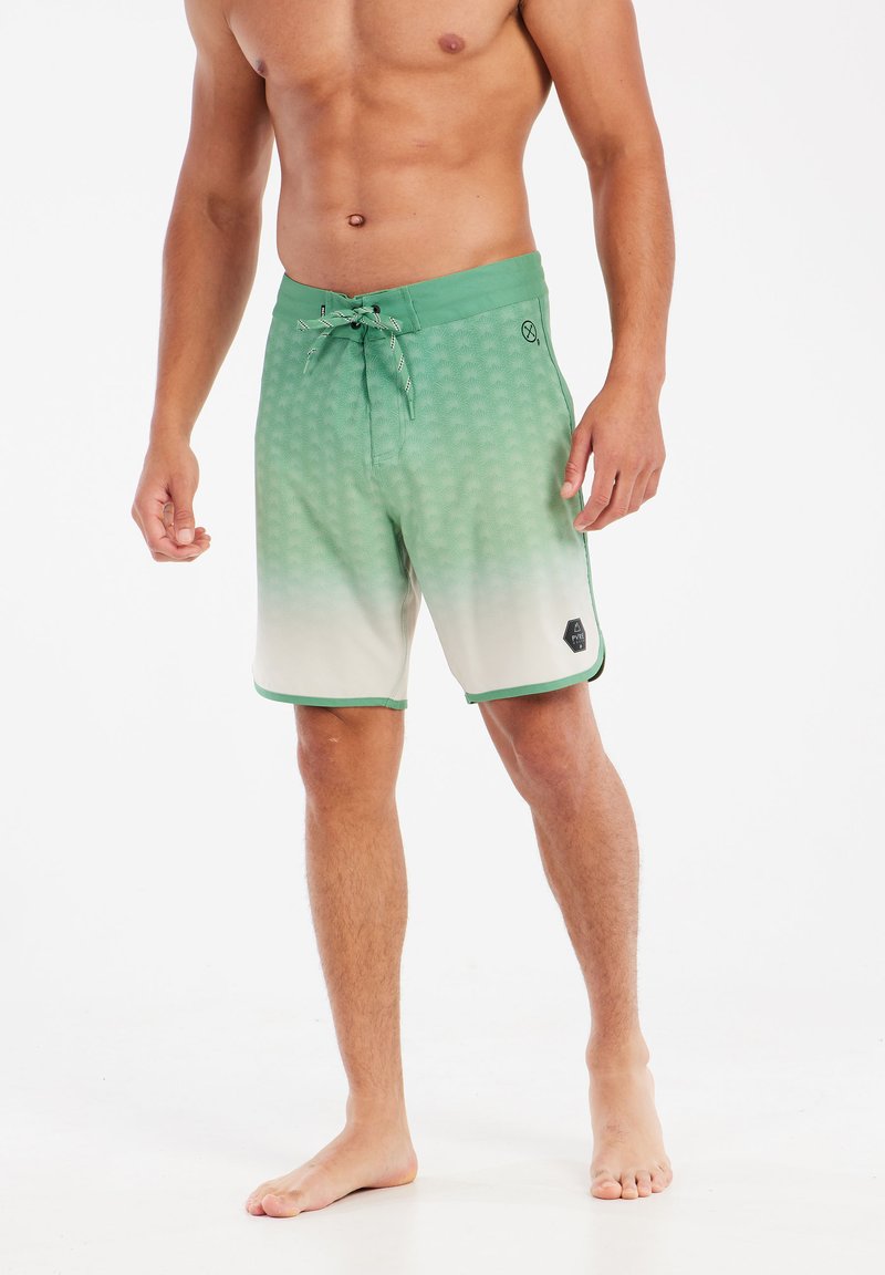 Groene verloopzwemshorts met een gestructureerd patroon, trekkoordsluiting en contrasterende afwerking. Geen zakken, lichtgewicht stof.