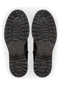 Semelles de bottes en caoutchouc noir avec des motifs de semelle profonds, comprenant des sections striées et une zone plate pour une traction accrue. Taille indiquée comme 37.