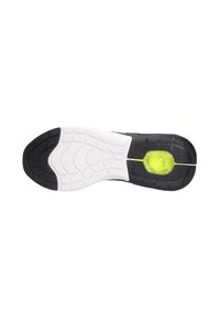 Schwarz-weiße Sohle eines Sportschuhs mit texturiertem Gummi, flexiblen Rillen und einem leuchtend gelben, runden Akzent im Fersenbereich.