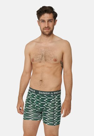 Grüne gemusterte Boxershorts mit einem schwarzen Bund, der mit "DANISH ENDURANCE" beschriftet ist, und geometrischen Formen in helleren Farbtönen.