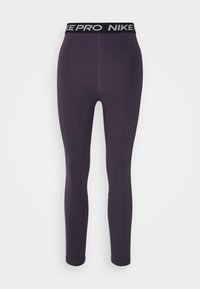Fioletowe legginsy sportowe z czarnym pasem Nike Pro, charakteryzujące się gładką fakturą i dopasowanym krojem dla wygody i elastyczności.