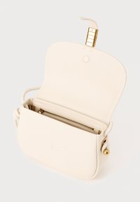 White leather handbag with a structured shape, magnetic closure, and a gold zipper pocket. Features decorative gold hardware accents.