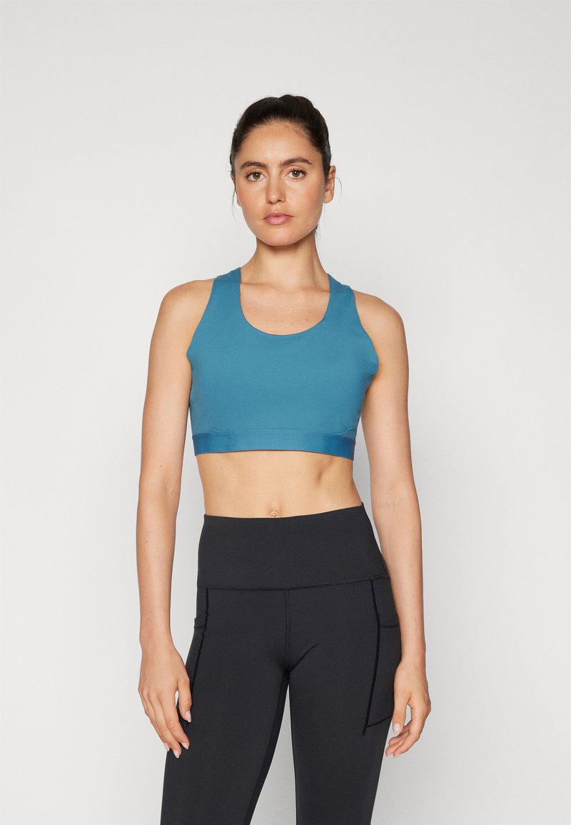 New Balance ATHLETICS SLEEK - Športni modrček s srednjo podporo - terrarium