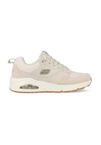 Zapatilla deportiva beige con un upper de cuero suave y malla, diseño perforado, mediopié acolchado y un compartimento de aire translúcido. Suela de goma.