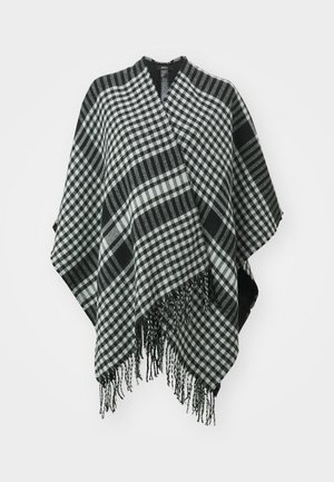 Crno-bijeli karirani pončo s resećim rubovima, izrađen od mekane tkanine, s drapiranjem i V-izrezom na vrhu.