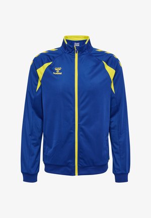 Niebieska kurtka sportowa z żółtymi akcentami, pełnym zamkiem błyskawicznym z przodu, wysokim kołnierzem oraz logo Hummel na lewej piersi i ramionach.