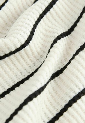 Cotton fabric with a textured surface, featuring vertical black stripes on a white background, creating a ribbed pattern.