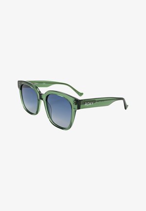 Occhiali da sole verdi traslucidi a forma di occhio di gatto con lenti sfumate blu e marchio "ROXY" sulle aste inclinate verso destra.
