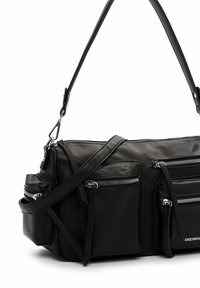 Black leather shoulder bag with multiple zippered pockets, adjustable strap, smooth texture, and silver-toned hardware accents.