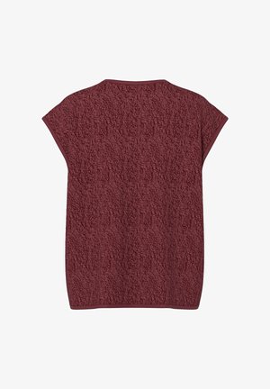 Bordo augšdaļa ar teksturētu vilnas materiālu, ar brīvāku formu, kapu piedurknēm un kontrastējošu brūnu apdari ap kaklu.