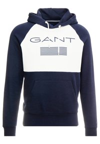 Sudadera azul marino con panel frontal blanco, que presenta un logo y rayas. Capucha con cordones, bolsillo tipo canguro, puños y dobladillo acanalados. Tela suave.