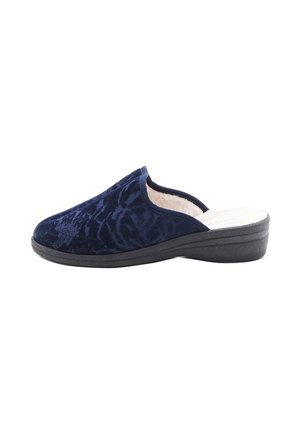 Chausson en velours bleu marine avec une semelle noire basse, un intérieur doux et un motif texturé subtil.