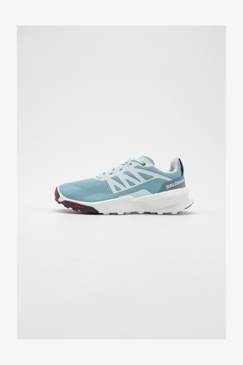 Helles Blaues Sportschuh mit Mesh-Obermaterial, weißen Akzenten und Gummisohle mit strukturiertem Griff. Markenlogo auf der Ferse sichtbar.