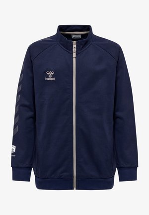 Marineblaue Zip-Jacke aus glattem Stoff mit Stehkragen, weißen Akzenten und einem Logo auf der Brust und dem Ärmel.