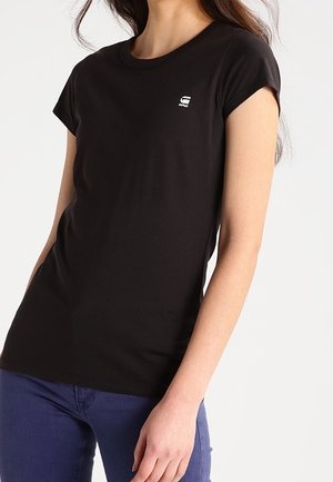 Zwart, katoenen T-shirt met korte mouwen, voorzien van een ronde hals en een klein logo op het linkerborstgebied. Gladde textuur, slim fit.