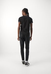 Under Armour CHALLENGER PIQUE - Treniņtērpa apakšdaļas - black