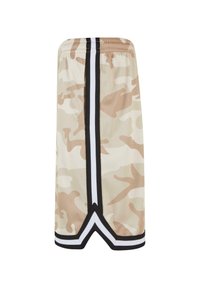 Beige színű camo hálós nadrág fekete és fehér oldalsávokkal. Jellemzője a rugalmas derékpánt és a V-alakú alsó rész.