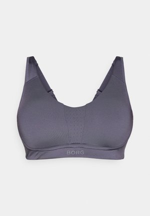 Lila Sport-BH mit nahtlosem Design, leicht gepolsterten Cups und perforiertem Vorderteil. Verfügt über verstellbare Träger und einen gebrandeten Bund.