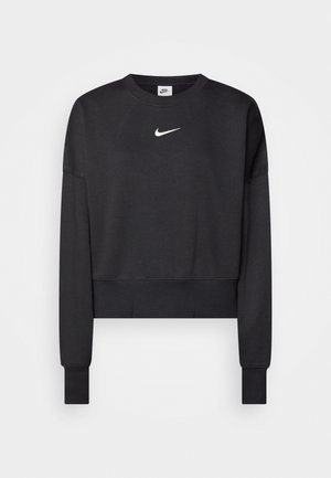 Sudadera corta negra hecha de una mezcla de algodón, con un cuello redondo, mangas largas y un logo blanco de Nike en el pecho.