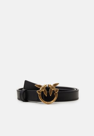 Black leather belt with a gold circular buckle featuring two detailed birds facing each other.