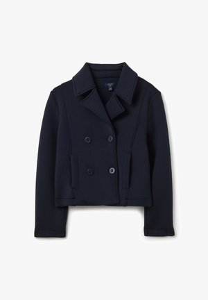 Veste bleu marine à double boutonnage en tissu doux. Elle présente des manches longues, un col à revers et deux poches avant avec des boutons.