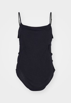 Black sleeveless top with thin straps, made of soft fabric. Features draped sides and a rounded hem for a relaxed fit.
