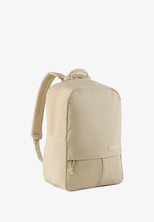 Beige backpack with a smooth texture, rounded corners, dual strap design, and a front pocket featuring a drawstring closure.