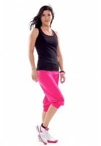 Black tank top, pink capri pants, and white sneakers with pink accents. Smooth fabric, fitted design, and knee-length pants.