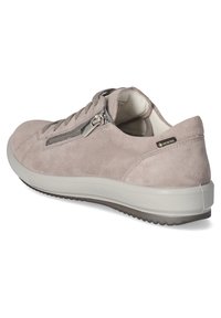 Light gray suede sneaker with a rounded toe, textured upper, zipper accent, and a cushioned white sole featuring a patterned tread.