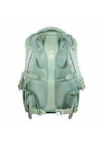 Green child carrier backpack with mesh padding, adjustable straps, and safety buckles. Features colorful dots on side and logo in center.